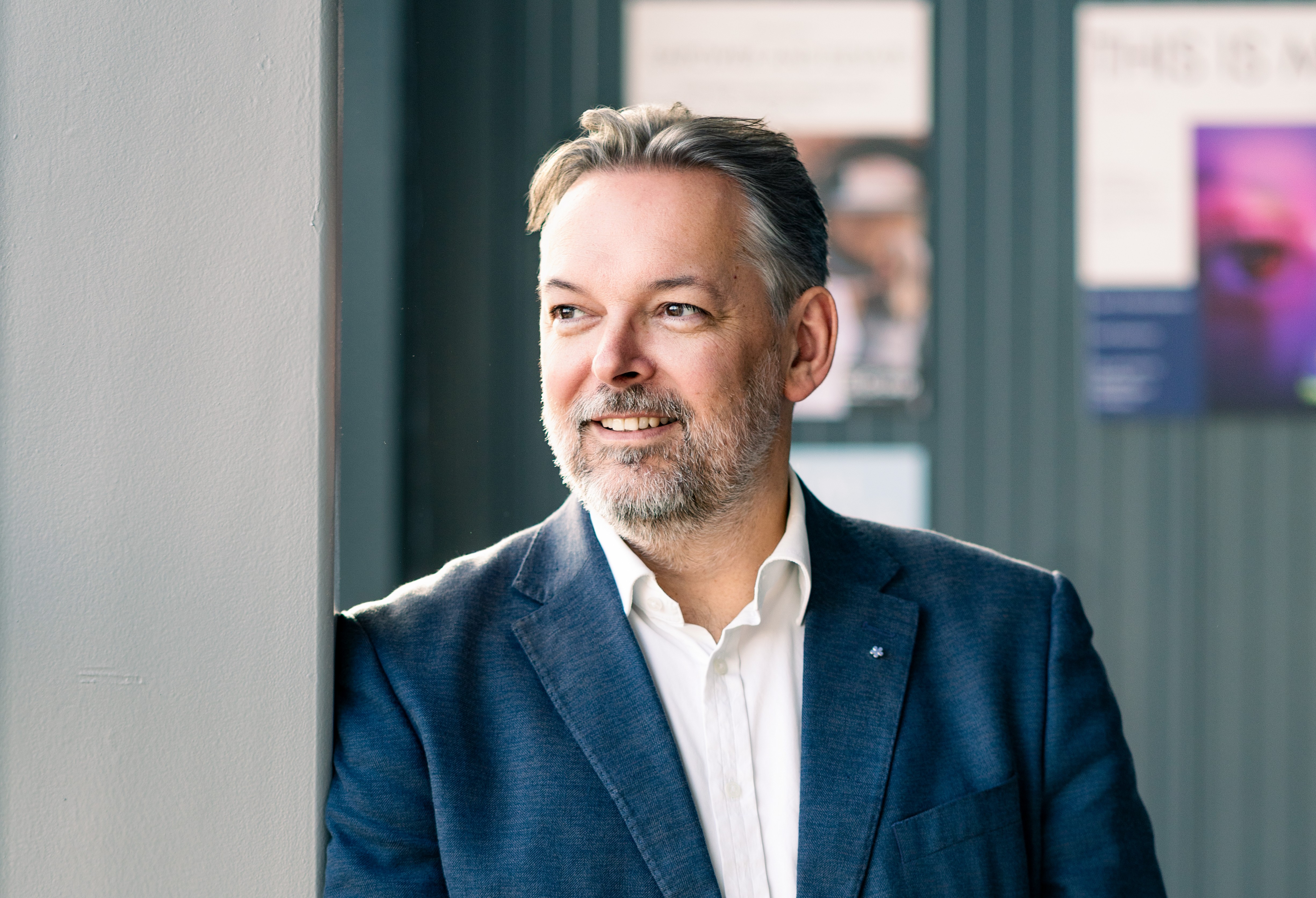 Owen Morgan, managing director at INTOO UK and Ireland, standing beside a window.