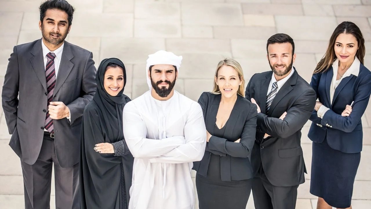 Image supplied by NES Fircroft Six business professionals standing together outside a modern building