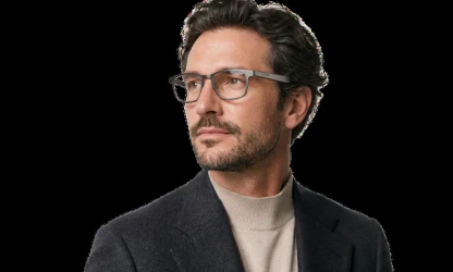 Man wearing glasses and a dark jacket