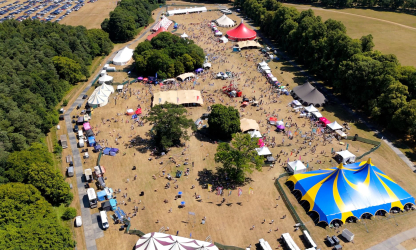 Aerial view of a previous RecFest UK event at Knebworth Park, with festival tents and attendees.